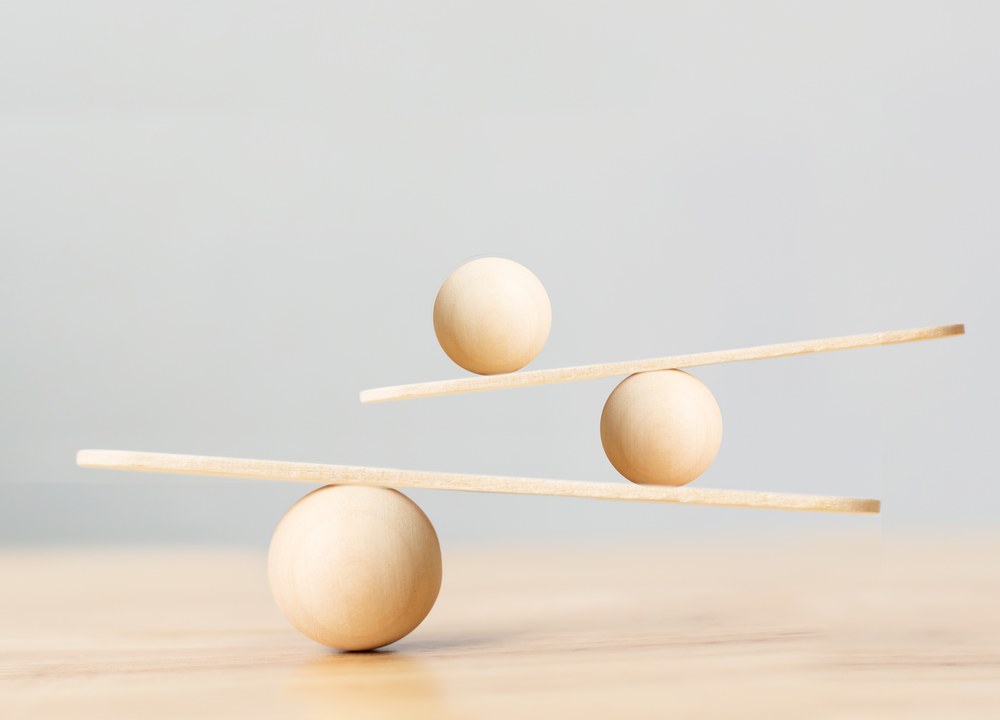 A wooden balance — minerals read as balance and ratios